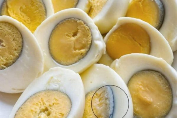 Why does a green ring appear around hard-boiled eggs?